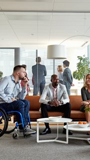 Diverse Executive Team Meeting in Office Reception Room