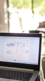 Man analyzing his investments in laptop at home